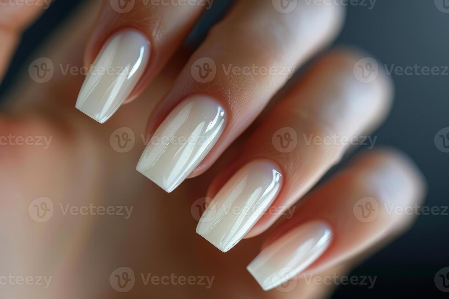 Woman showing her new milky white gel nail polish manicure photo