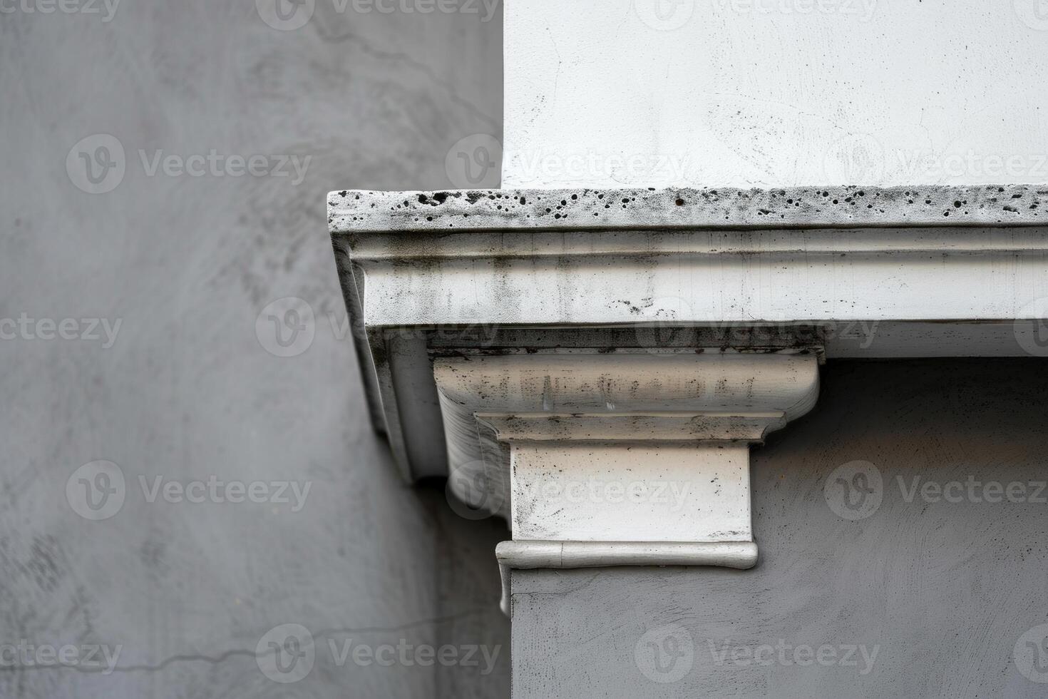 Detail of a building facade showing signs of weathering and age photo