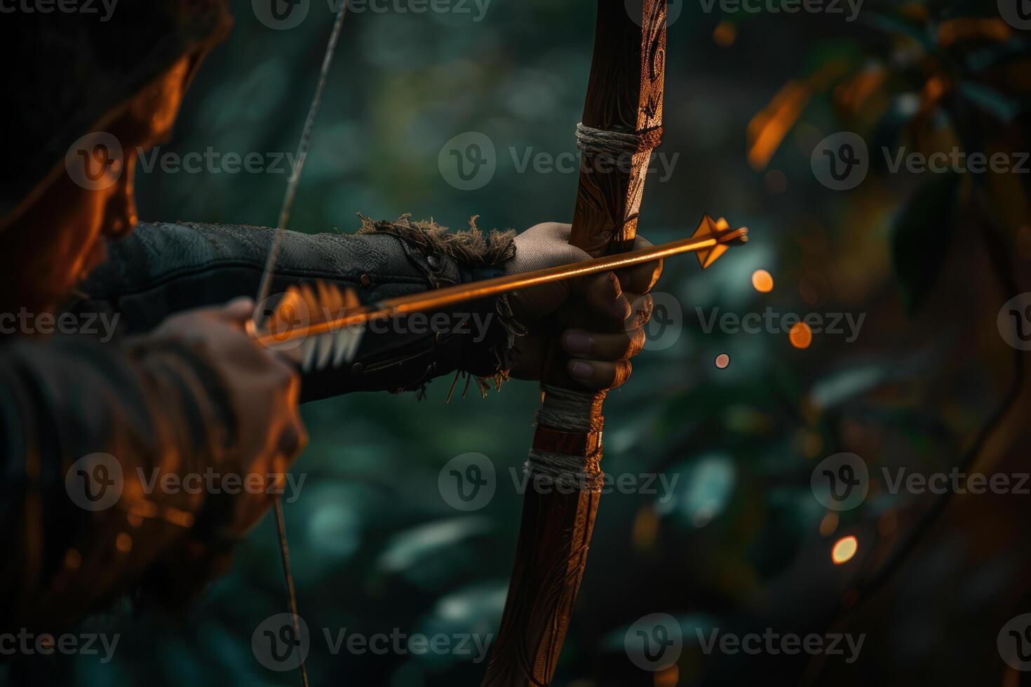 Archer taking aim with bow and arrow in forest photo