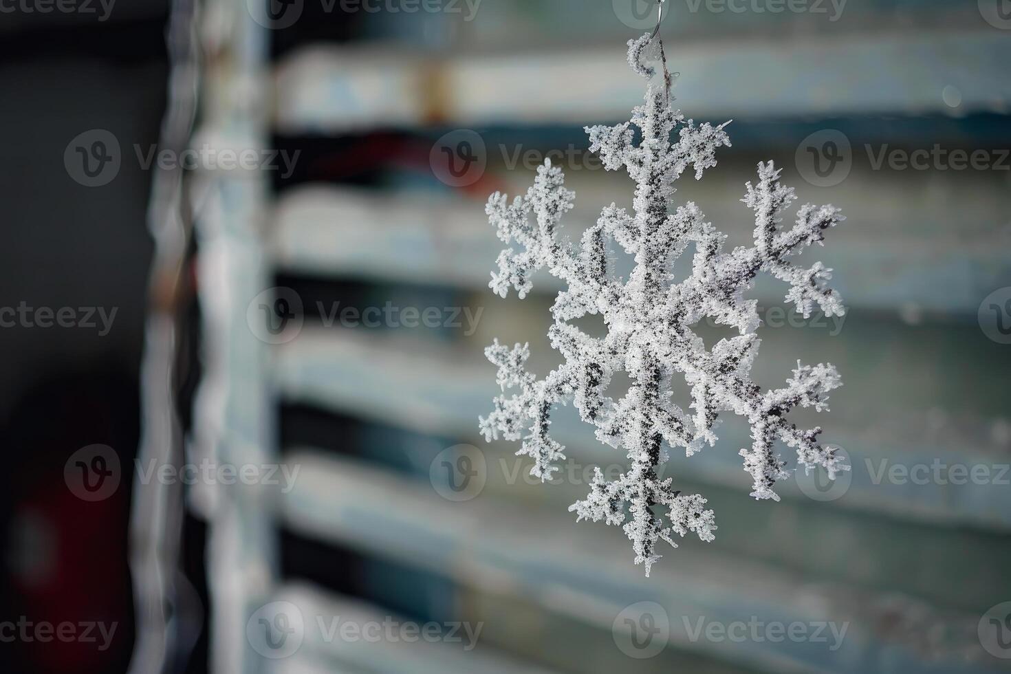 Frozen snowflake hanging outside on a cold winter day photo