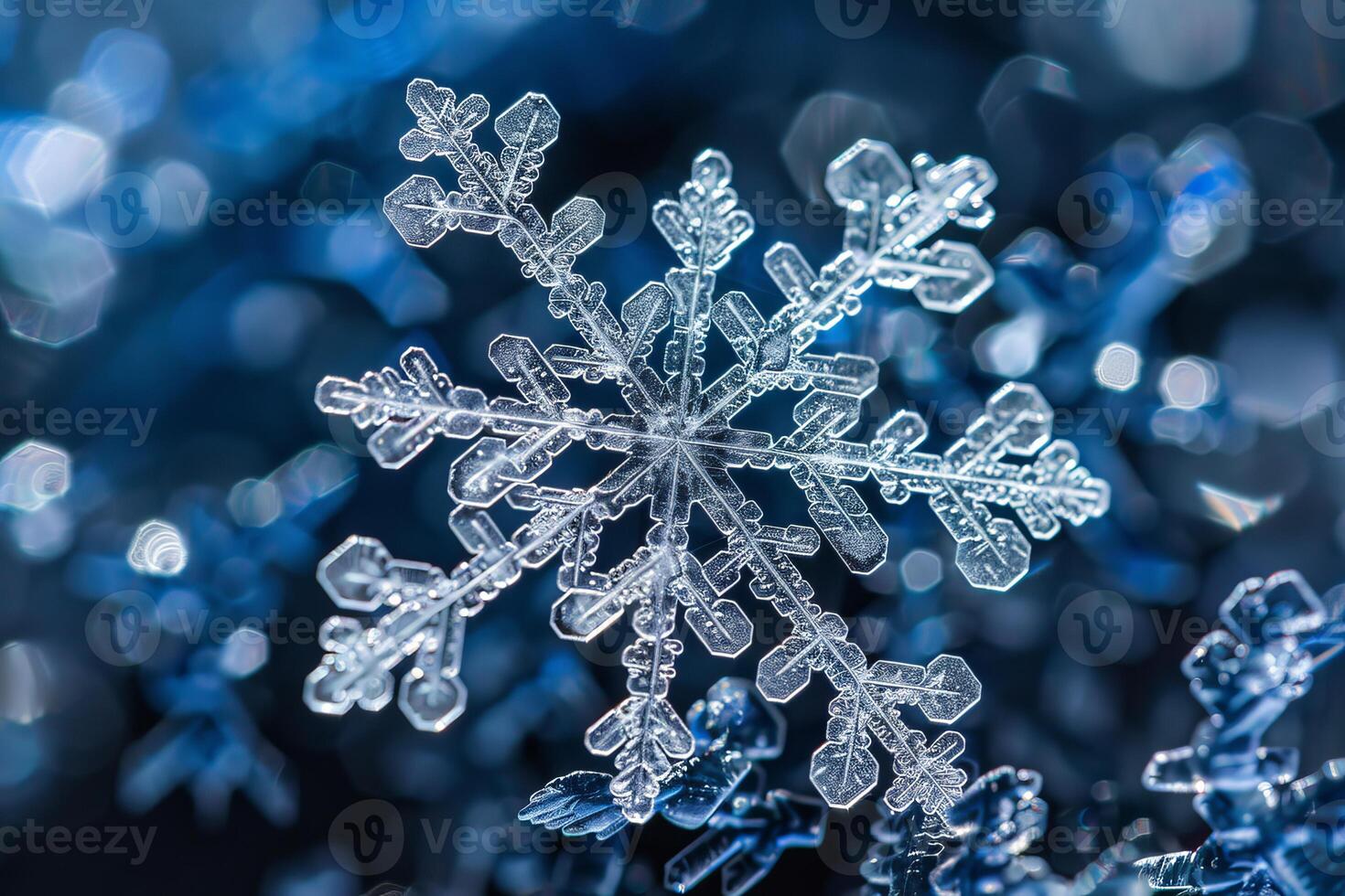 Macro photo of snowflake crystal forming on dark blue background