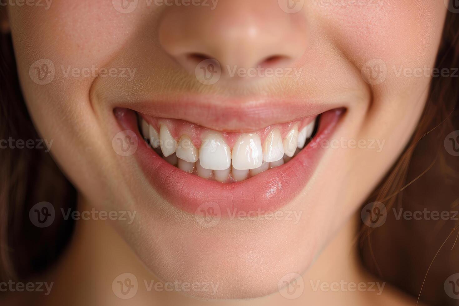 Woman smiling showing healthy white teeth close up photo