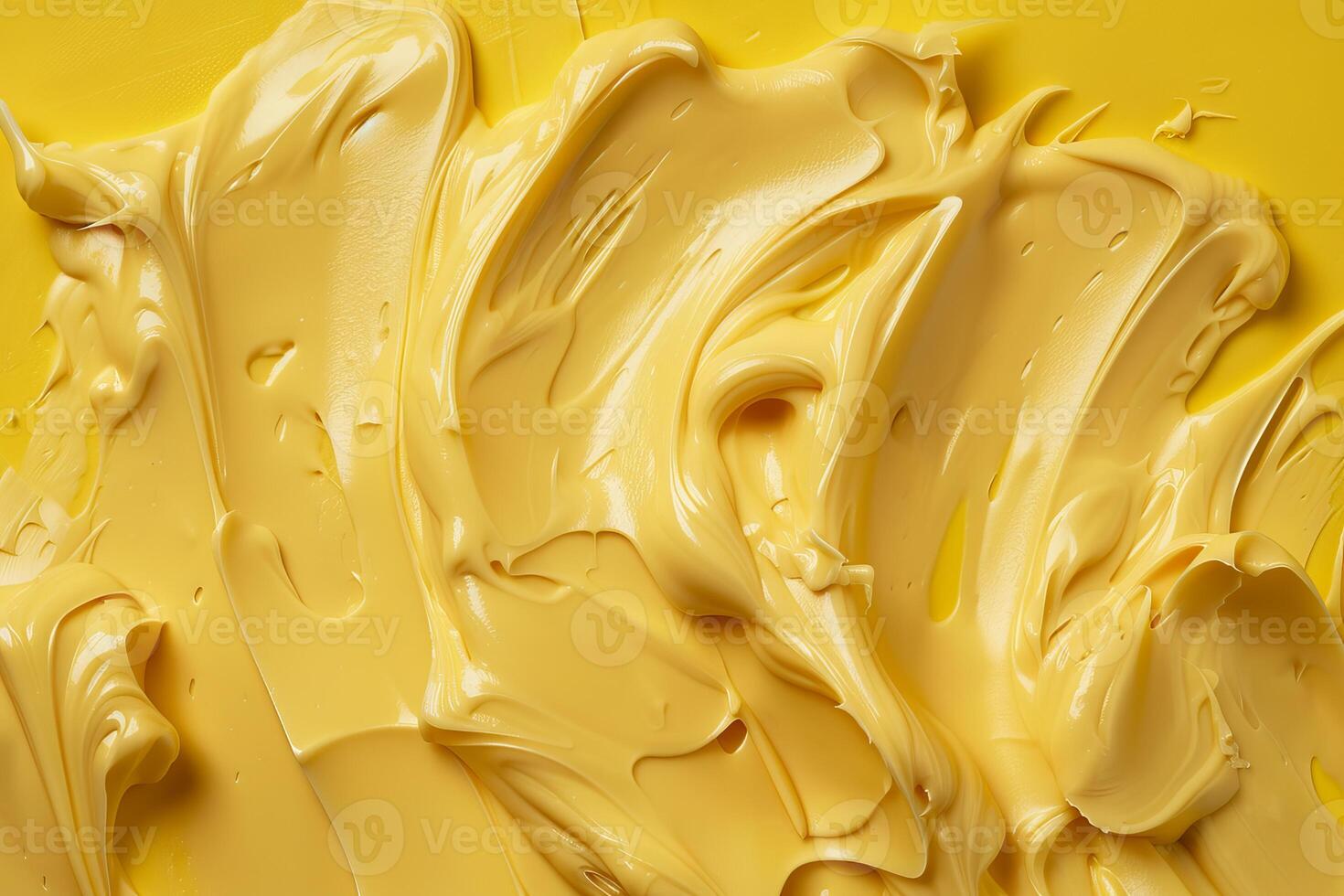 Yellow cosmetic cream background forming a wavy pattern photo