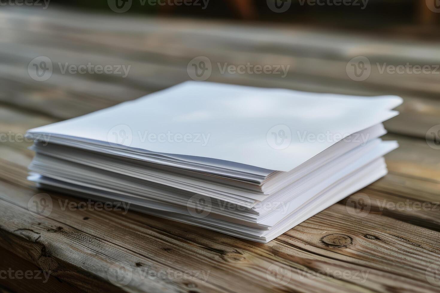Stack of blank white paper sitting on rustic wooden table photo