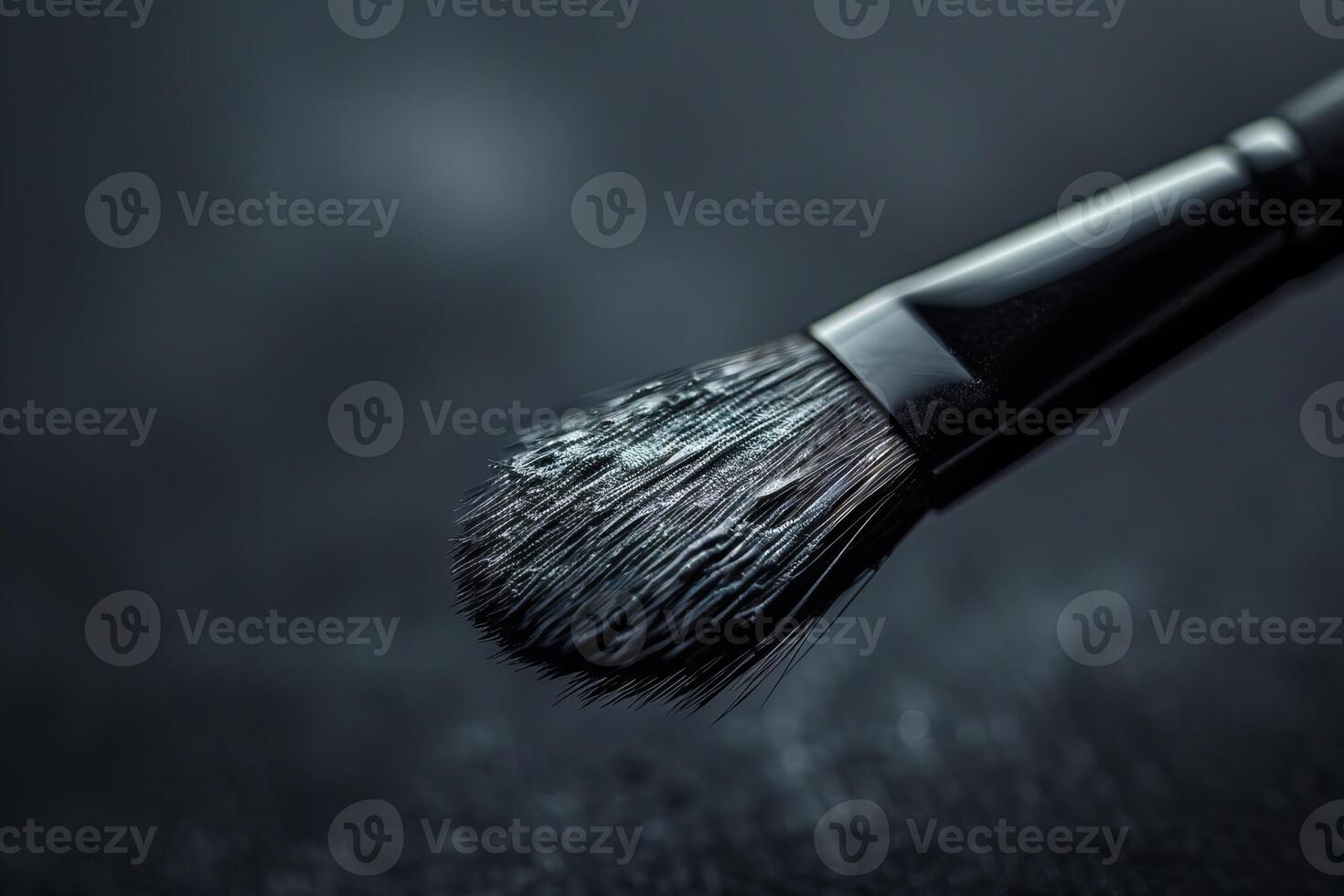 Professional makeup brush covered in eyeshadow pigment dust photo