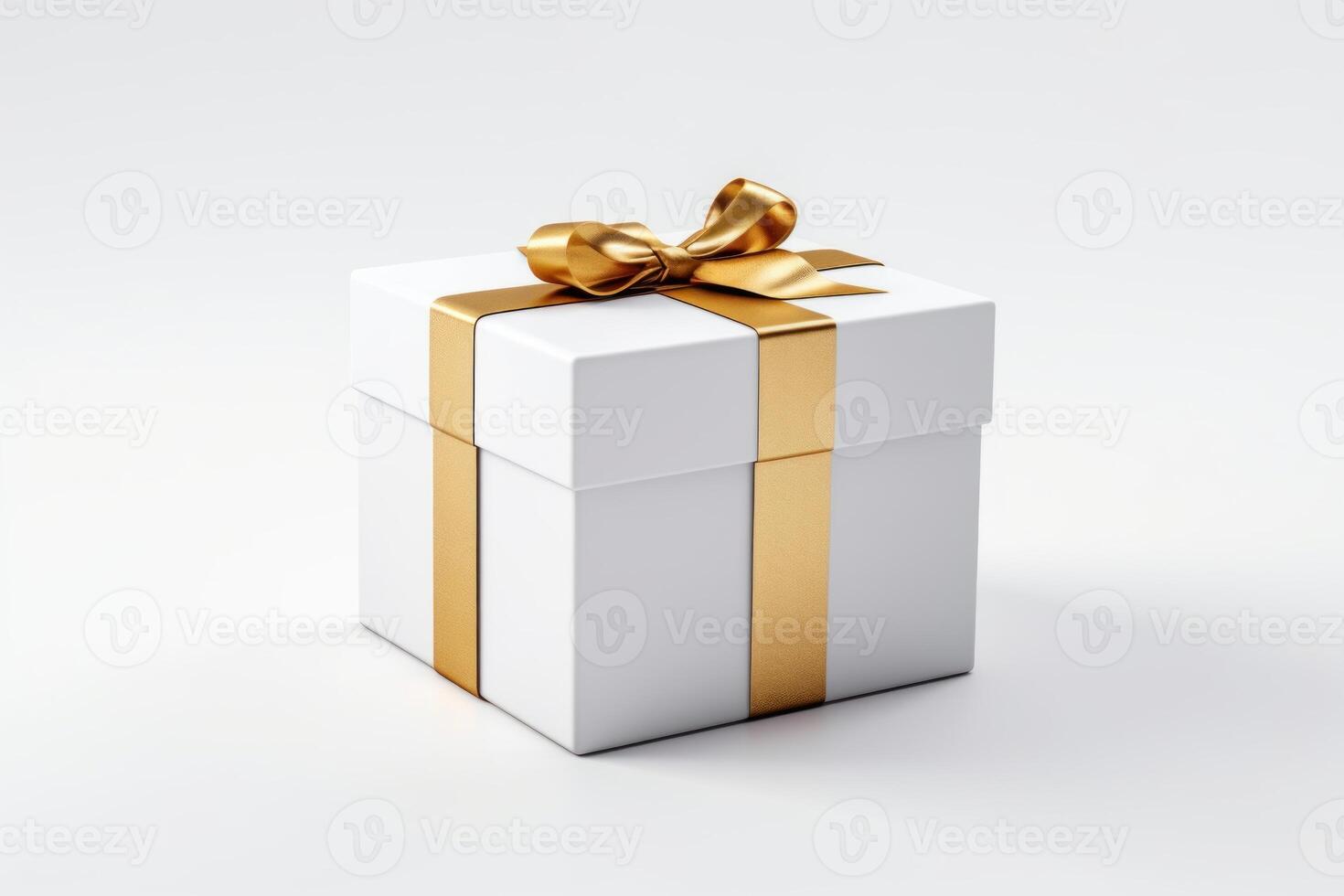 Elegant white gift box with golden ribbon photo