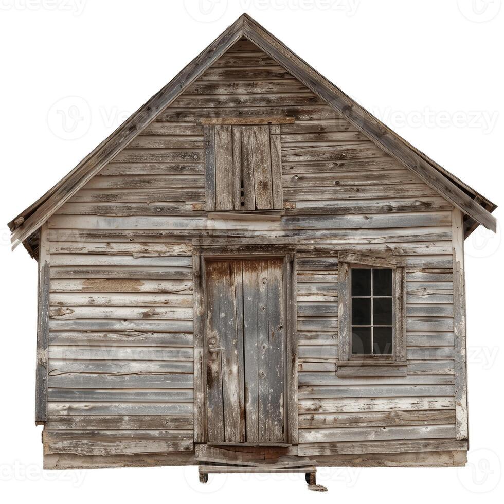 Old abandoned wooden house with boarded up windows is falling apart photo