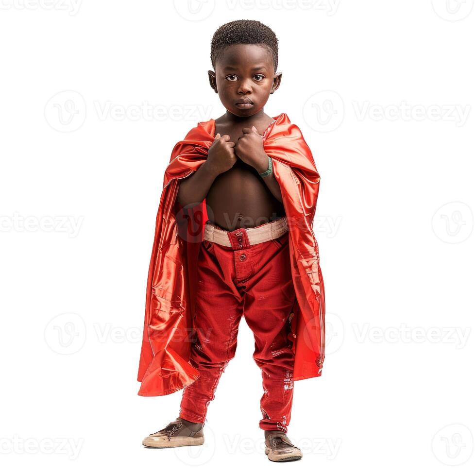 Young boy wearing red cape posing as superhero photo
