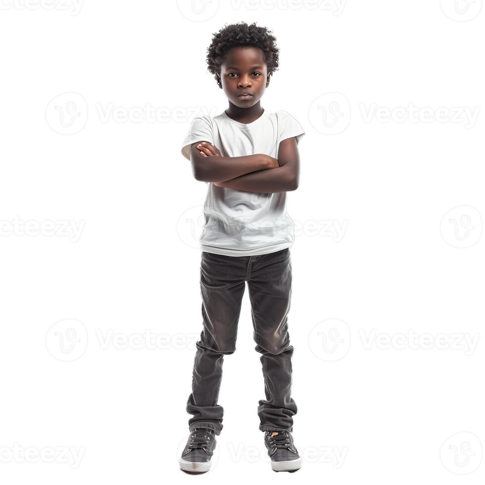 Full length portrait of a serious boy standing with arms crossed photo