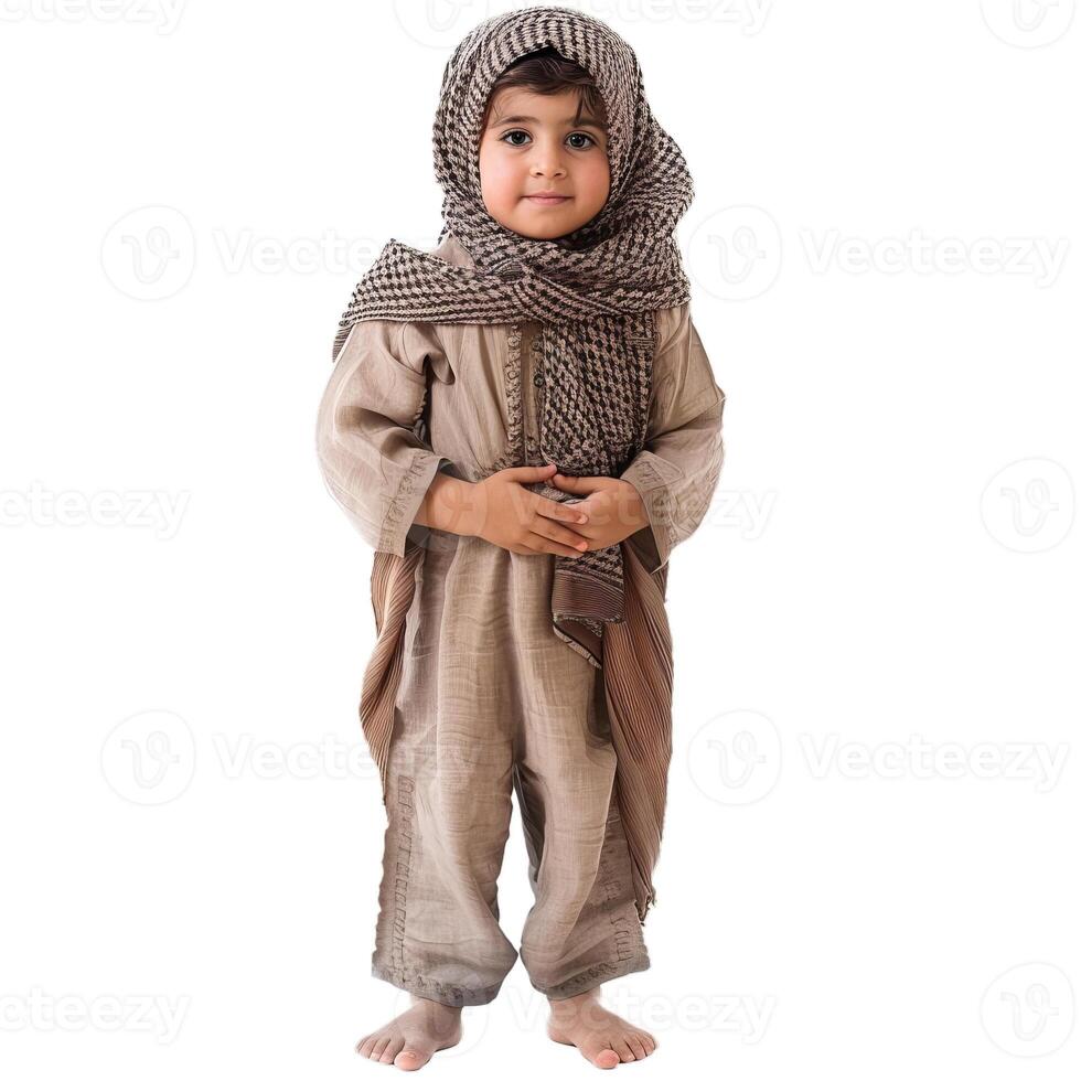 Young boy wearing traditional clothing posing on white background photo