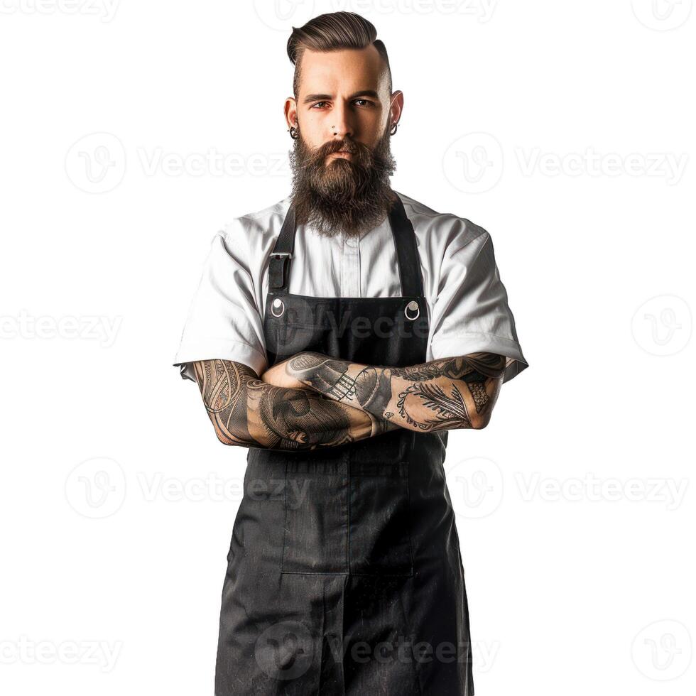 Serious bearded chef with arms crossed wearing black apron photo