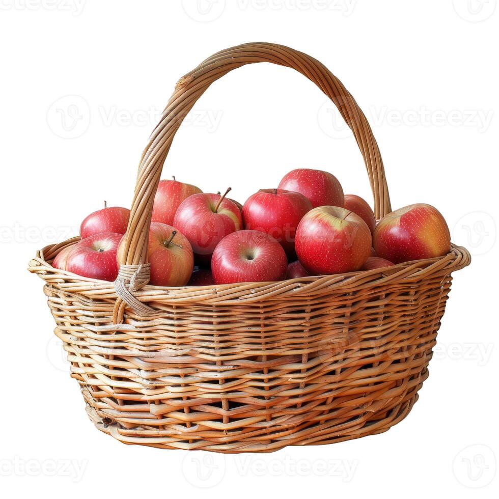 Wicker basket overflowing with freshly picked red apples photo