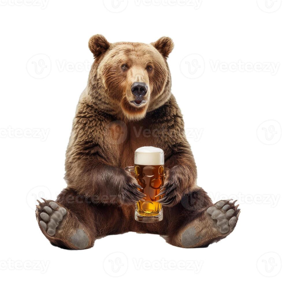 Brown bear sitting and holding glass of beer isolated on white background photo