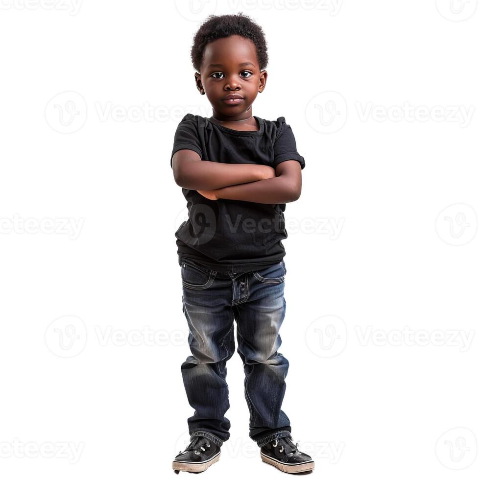 Young boy standing with arms crossed looking serious photo