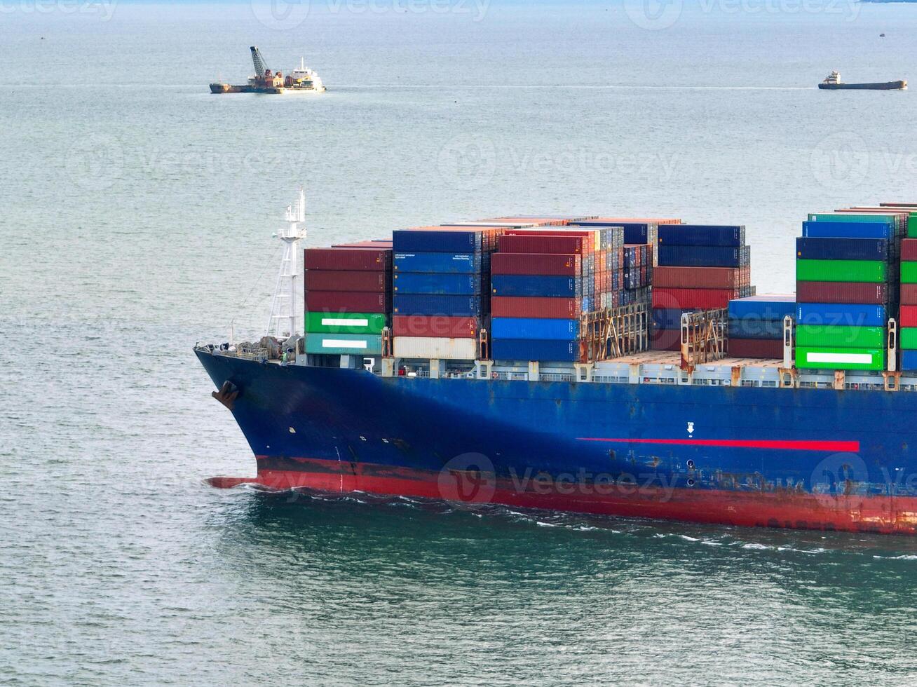 Aerial view of container cargo ship at sea. International shipping and logistics. Maritime freight transportation. Global trade and export import industry. Commercial vessel carrying containers. photo