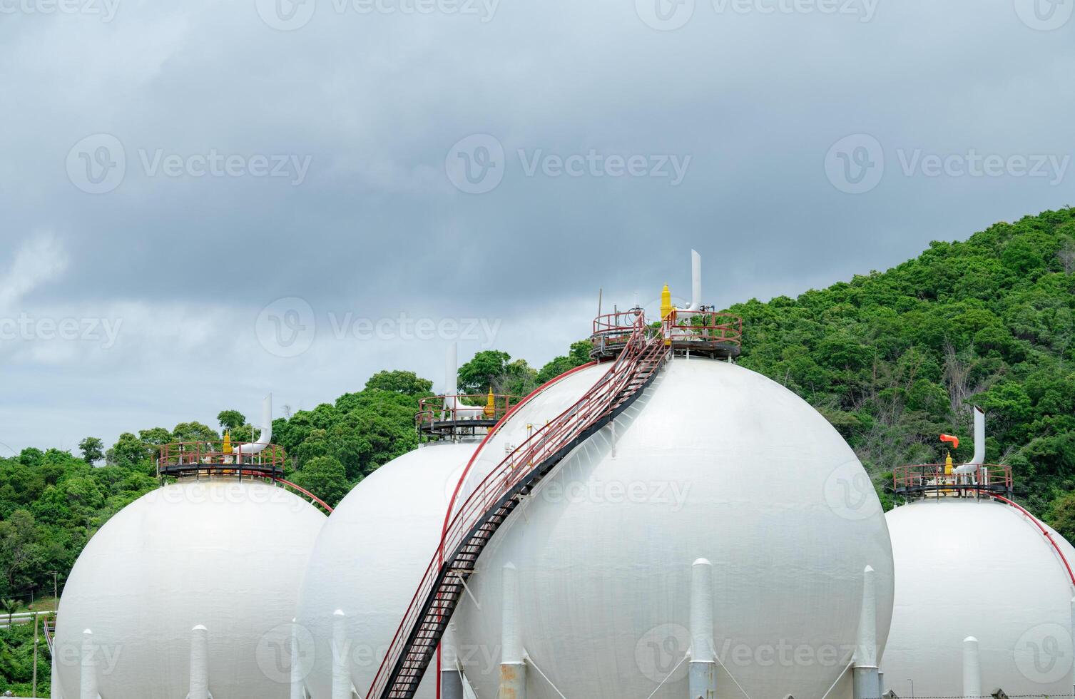 Industrial gas storage tank in factory, LNG or liquefied natural gas container in petroleum refinery. Energy industry infrastructure for natural gas storage. Global energy supply. Fuel reservoir. photo