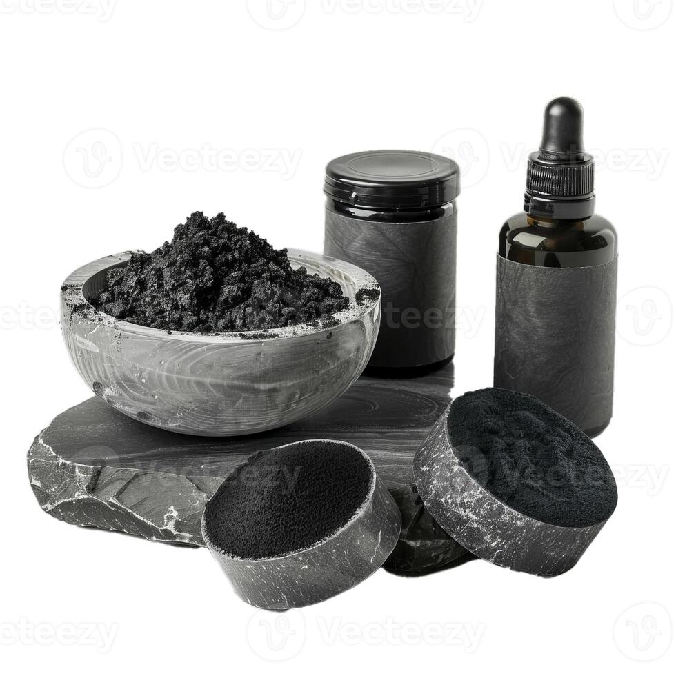 Activated charcoal powder, scrub, cream and serum standing on stone pedestal photo