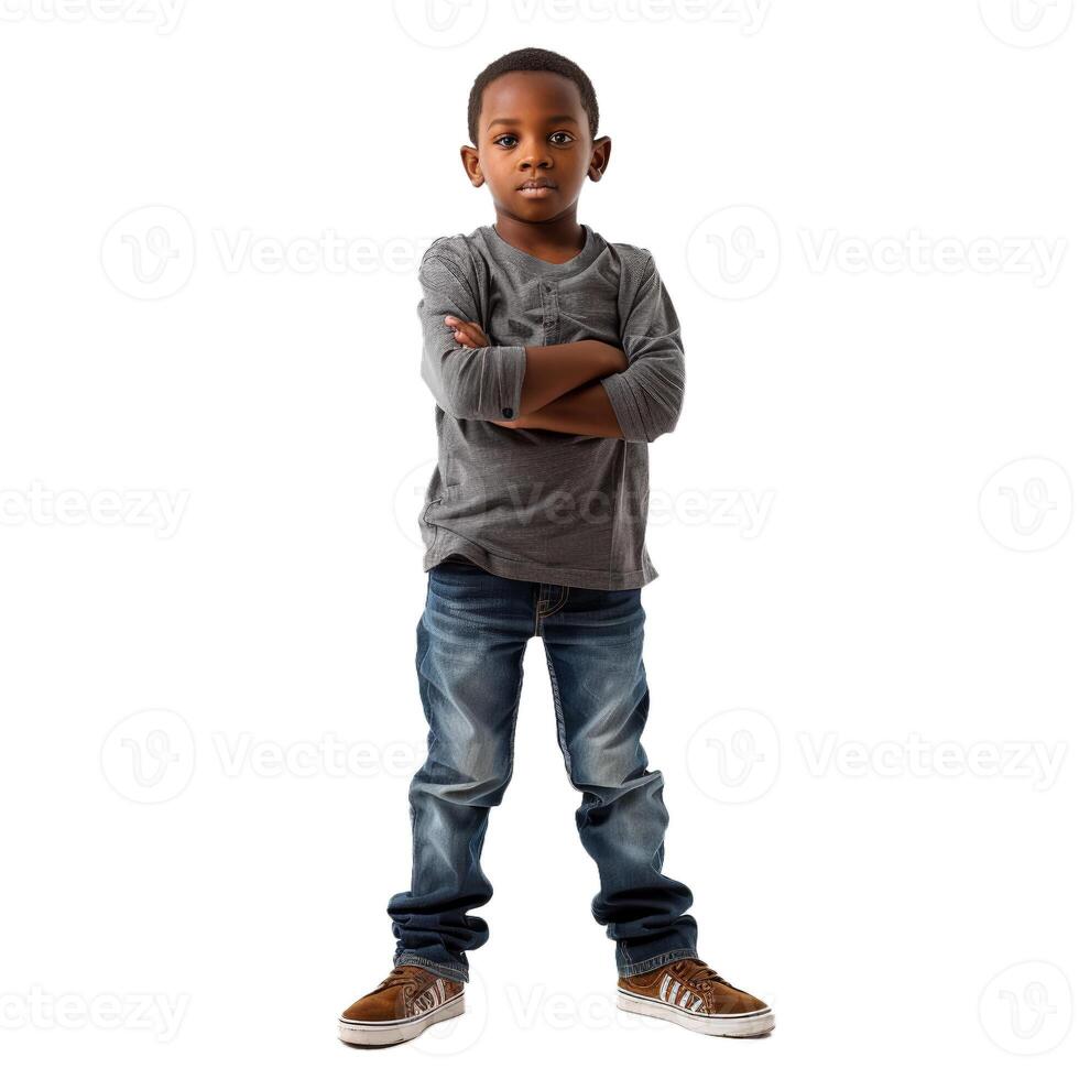 Young boy standing with arms crossed on white background photo