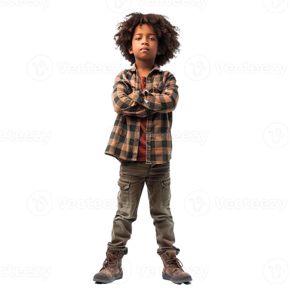 Young boy crossing his arms and standing strong with confidence photo