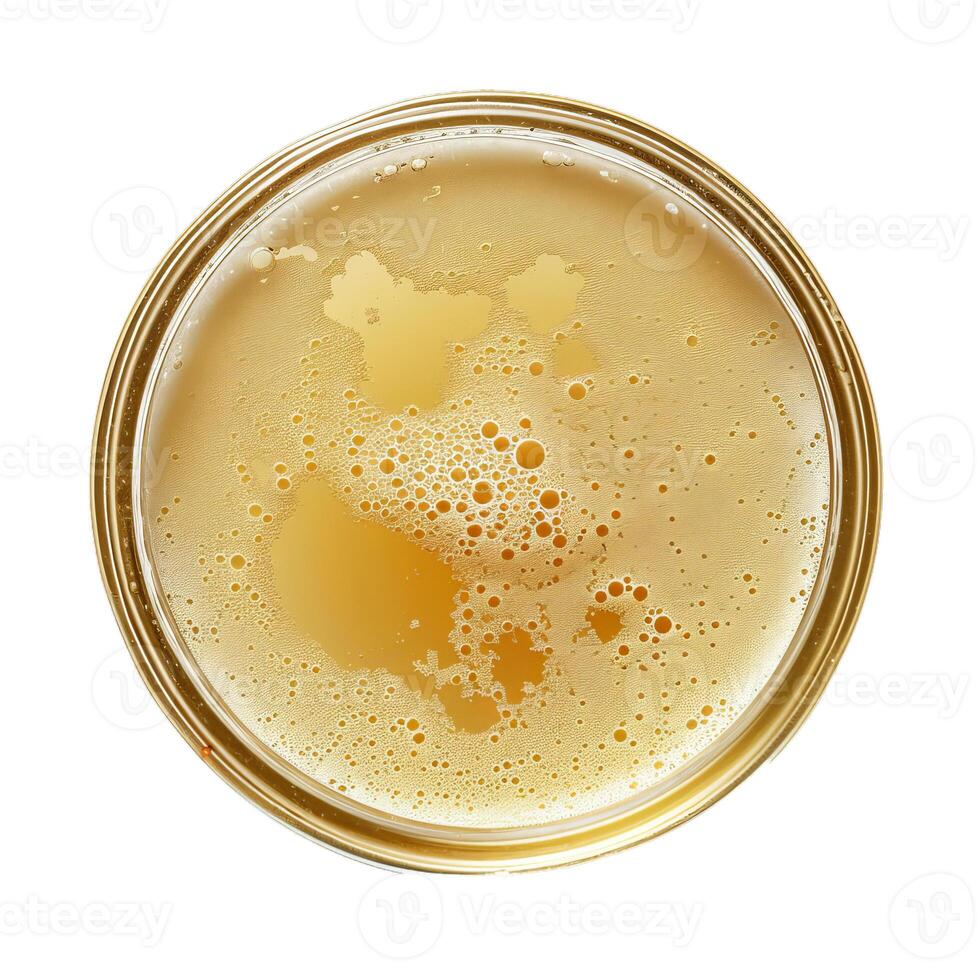 Glass of beer with bubbles forming a circle in the center photo