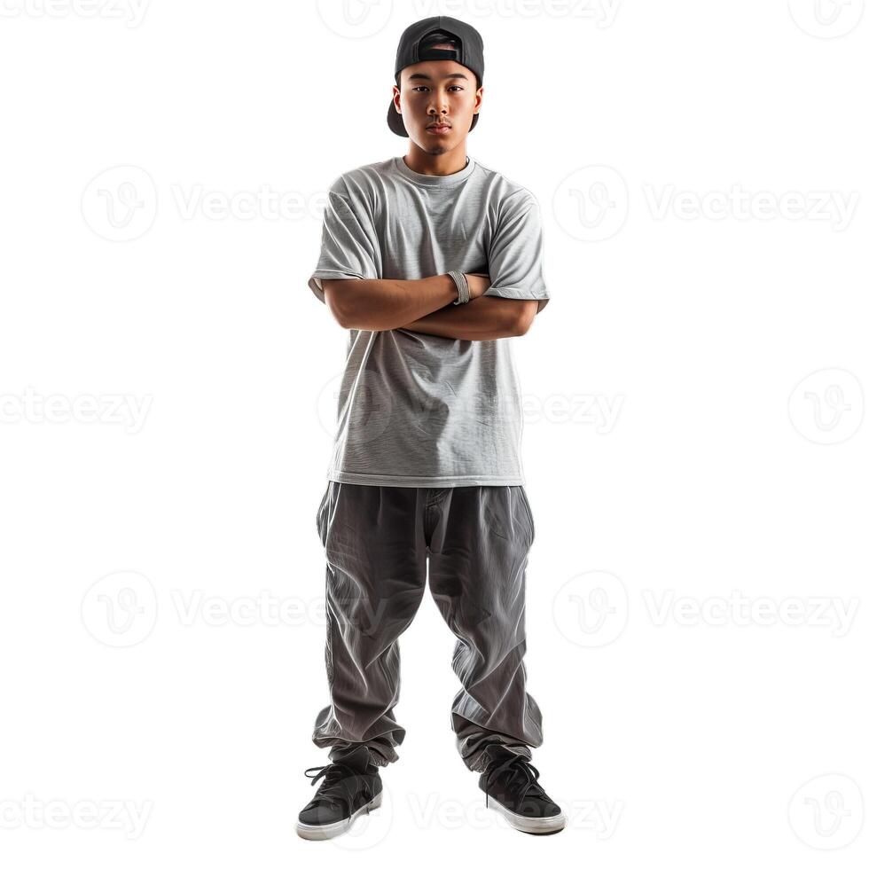 Young man wearing a cap is standing with crossed arms photo