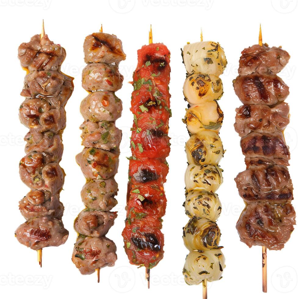 Five skewers with grilled meat, tomatoes and onions isolated on white background photo
