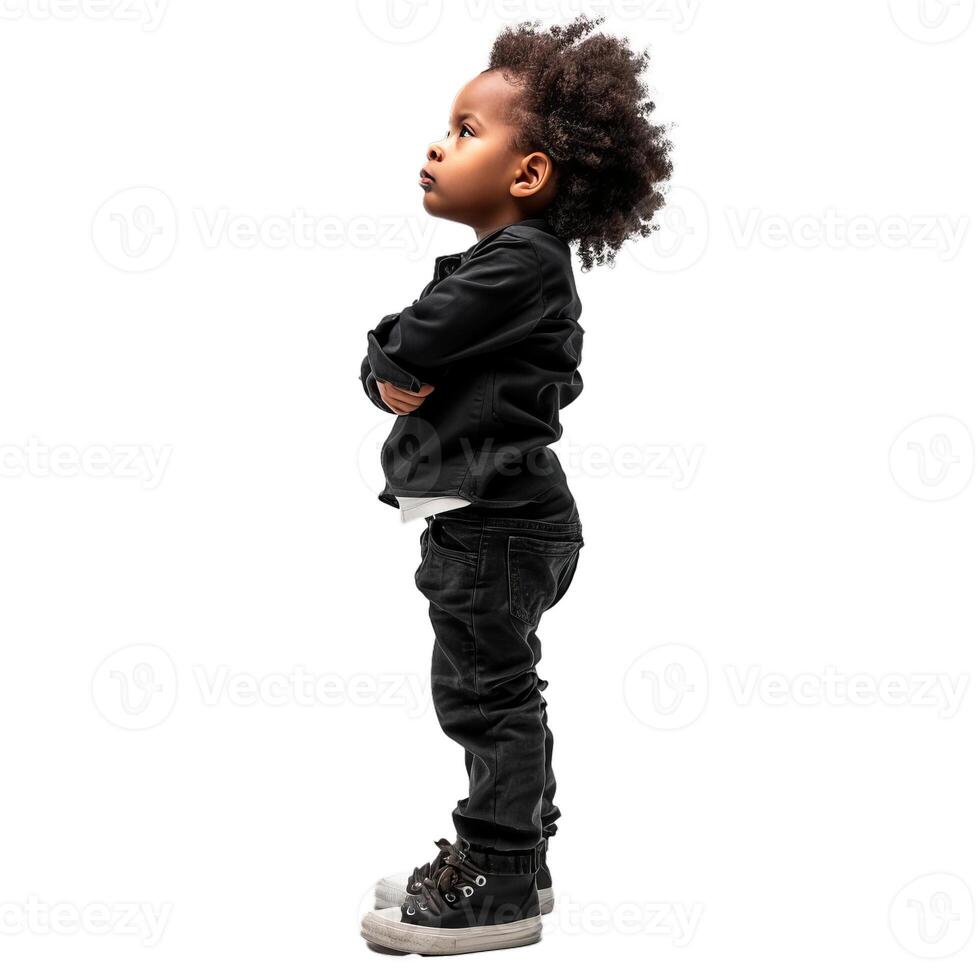 Little boy with afro hair style posing with folded arms looking up photo