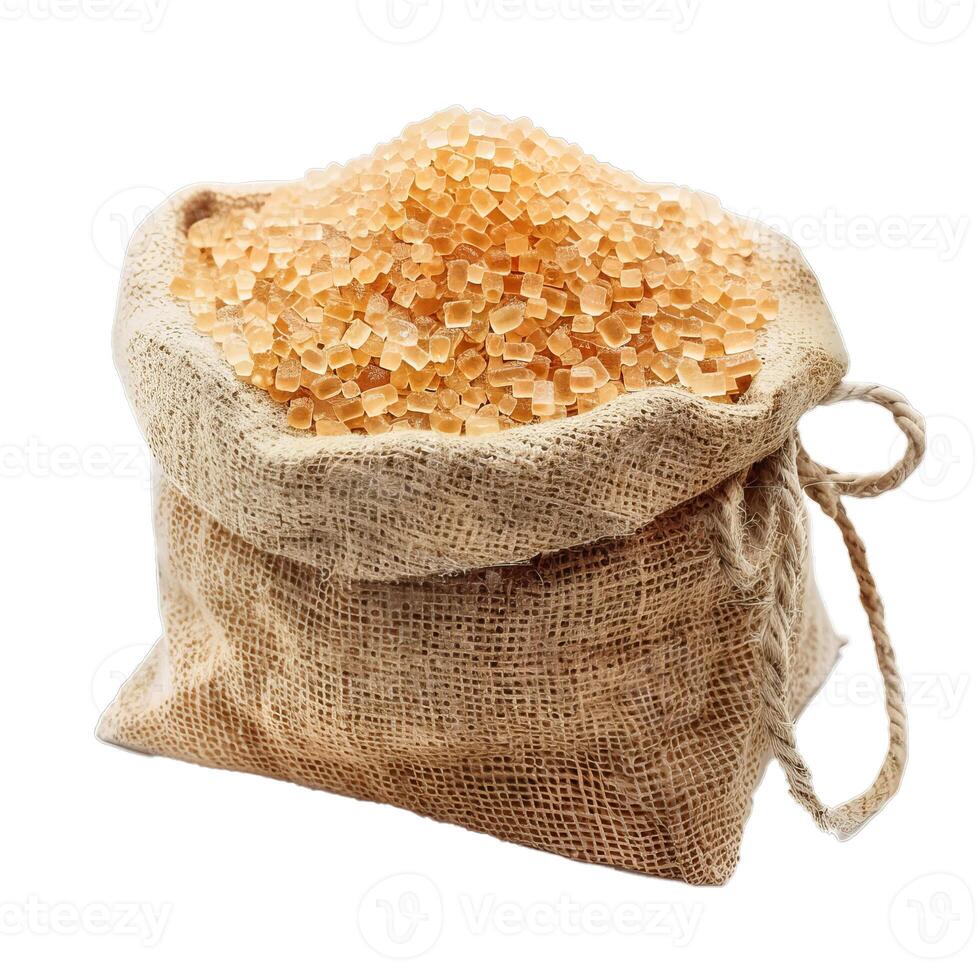 Full burlap sack overflowing with raw cane sugar crystals photo