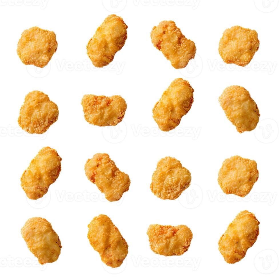 Delicious crispy chicken nuggets floating on white background photo