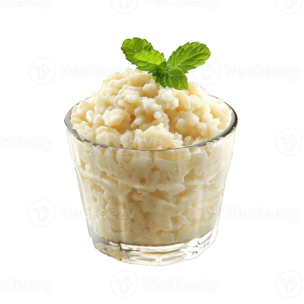 Delicious rice pudding dessert with mint garnish in glass photo