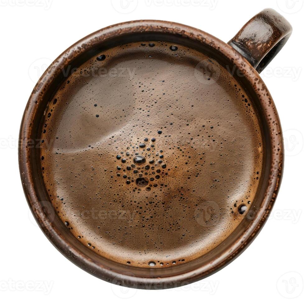 Aromatic black coffee is filling a rustic brown coffee cup photo