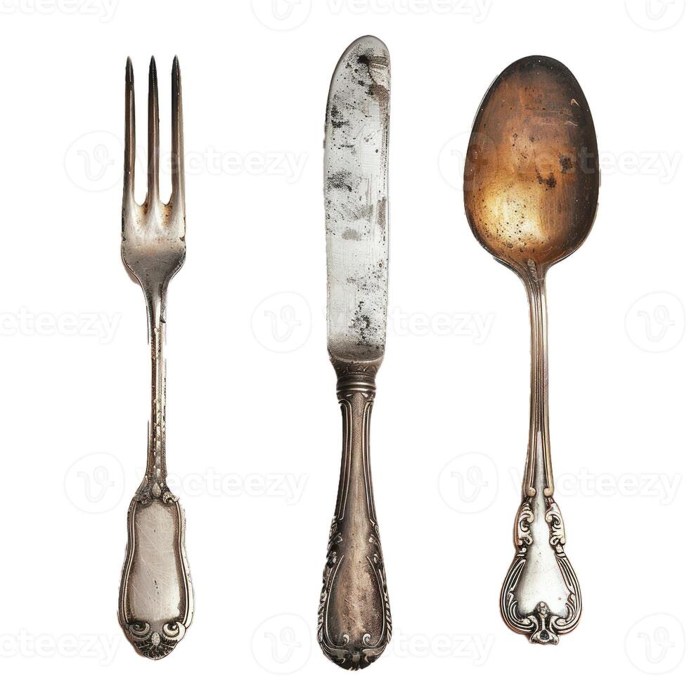 Antique silverware set showing a knife fork and spoon photo