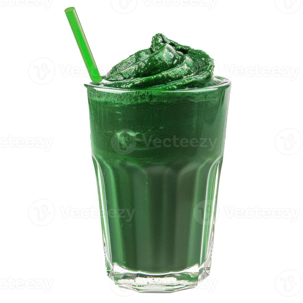 Green smoothie with a straw in a tall glass standing on a white surface photo