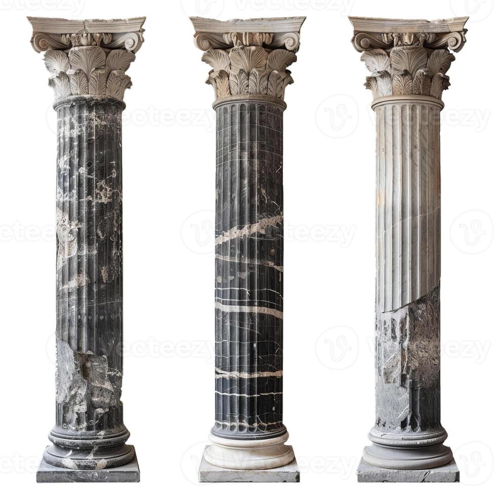 Three different marble columns with capitals are showing various states of damage and weathering photo