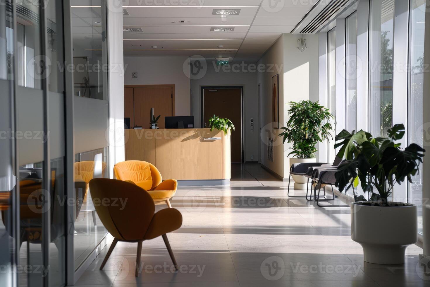 Modern office reception area with sunlight streaming through windows photo