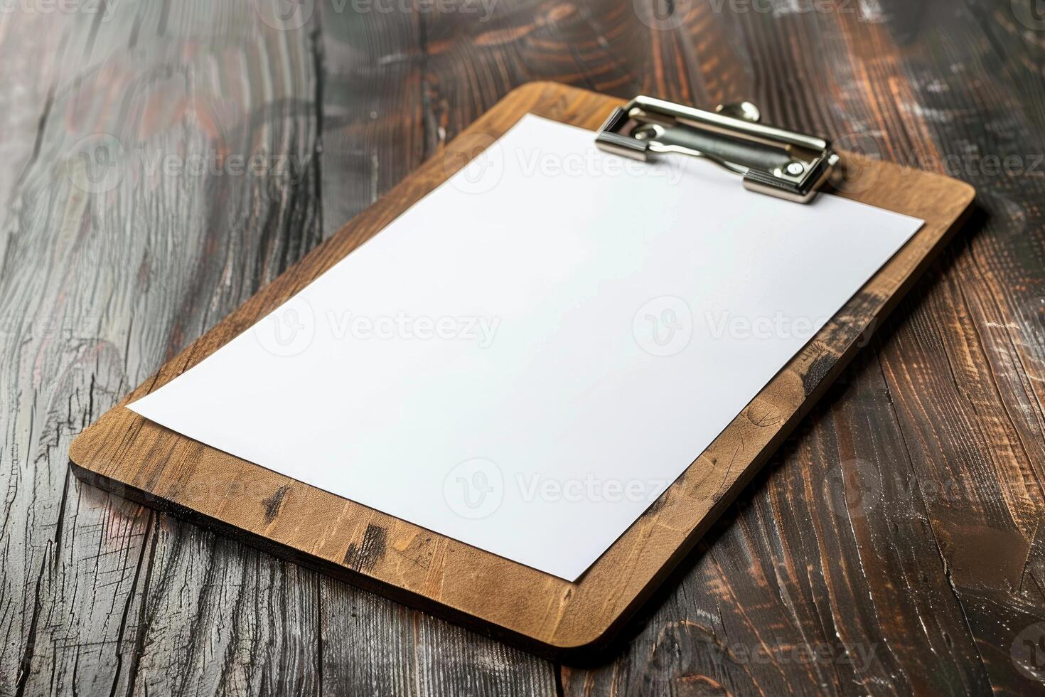 Wooden clipboard with blank paper lying on rustic table with copy space photo