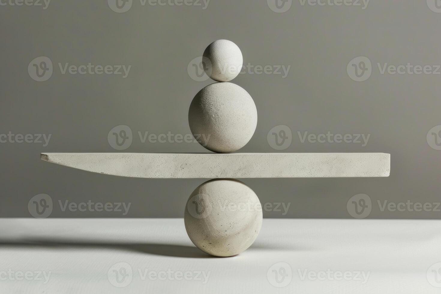 Balancing stones balancing on a seesaw representing harmony and balance photo