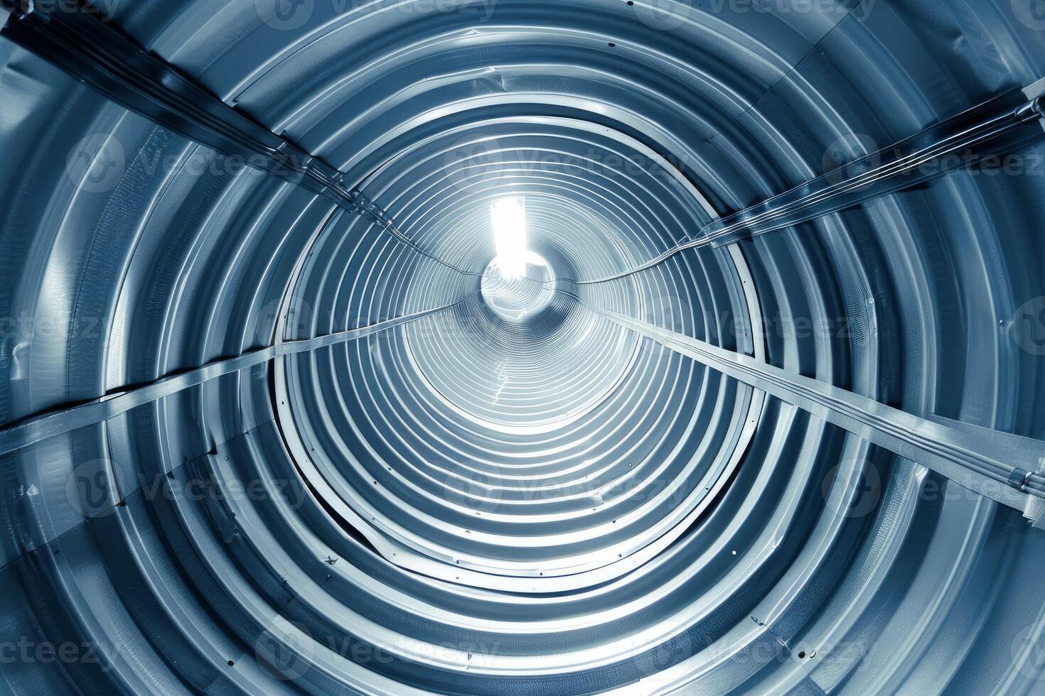 Round metal tunnel structure showing diminishing perspective photo