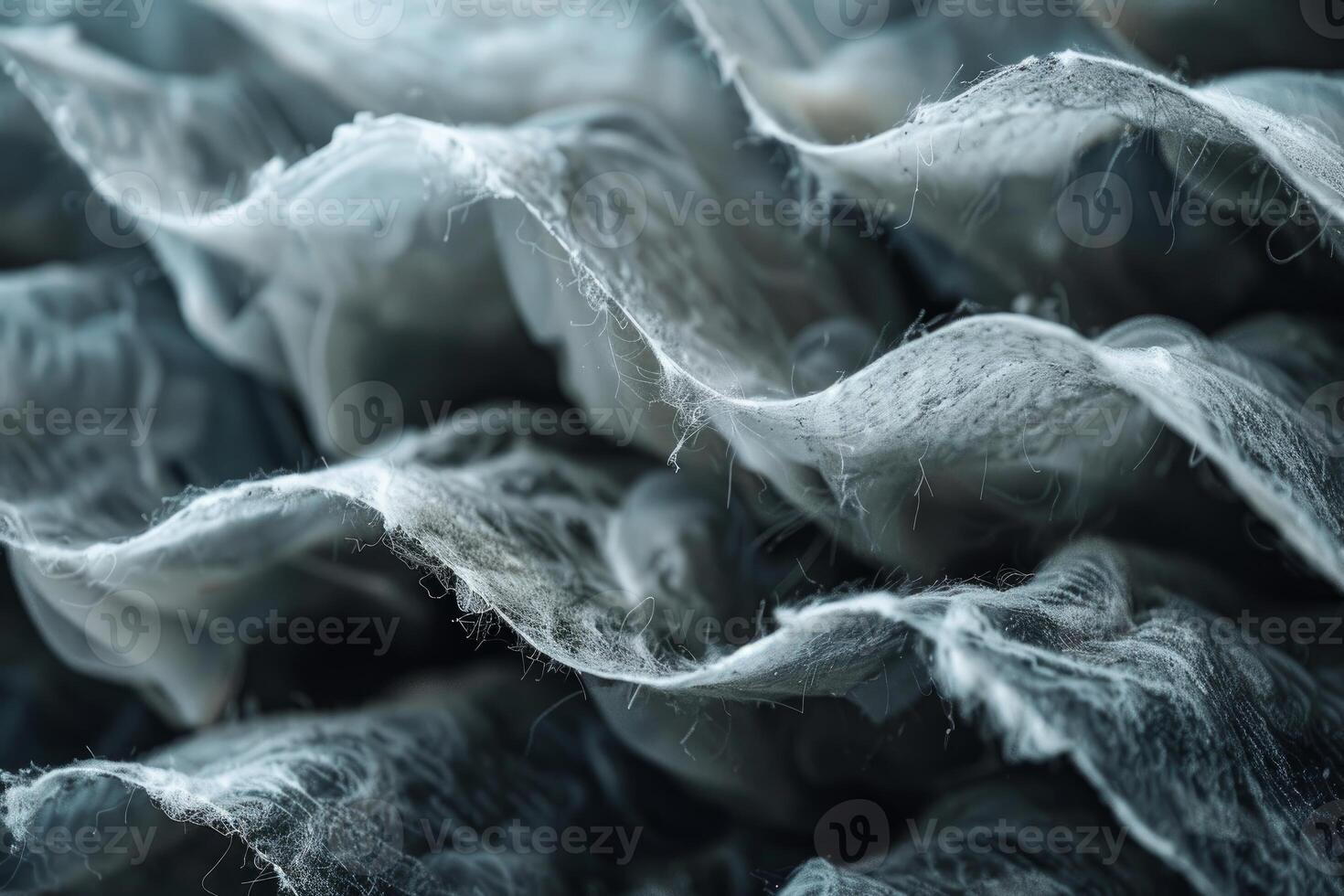 Closeup of white cobwebs forming abstract shapes for halloween background photo