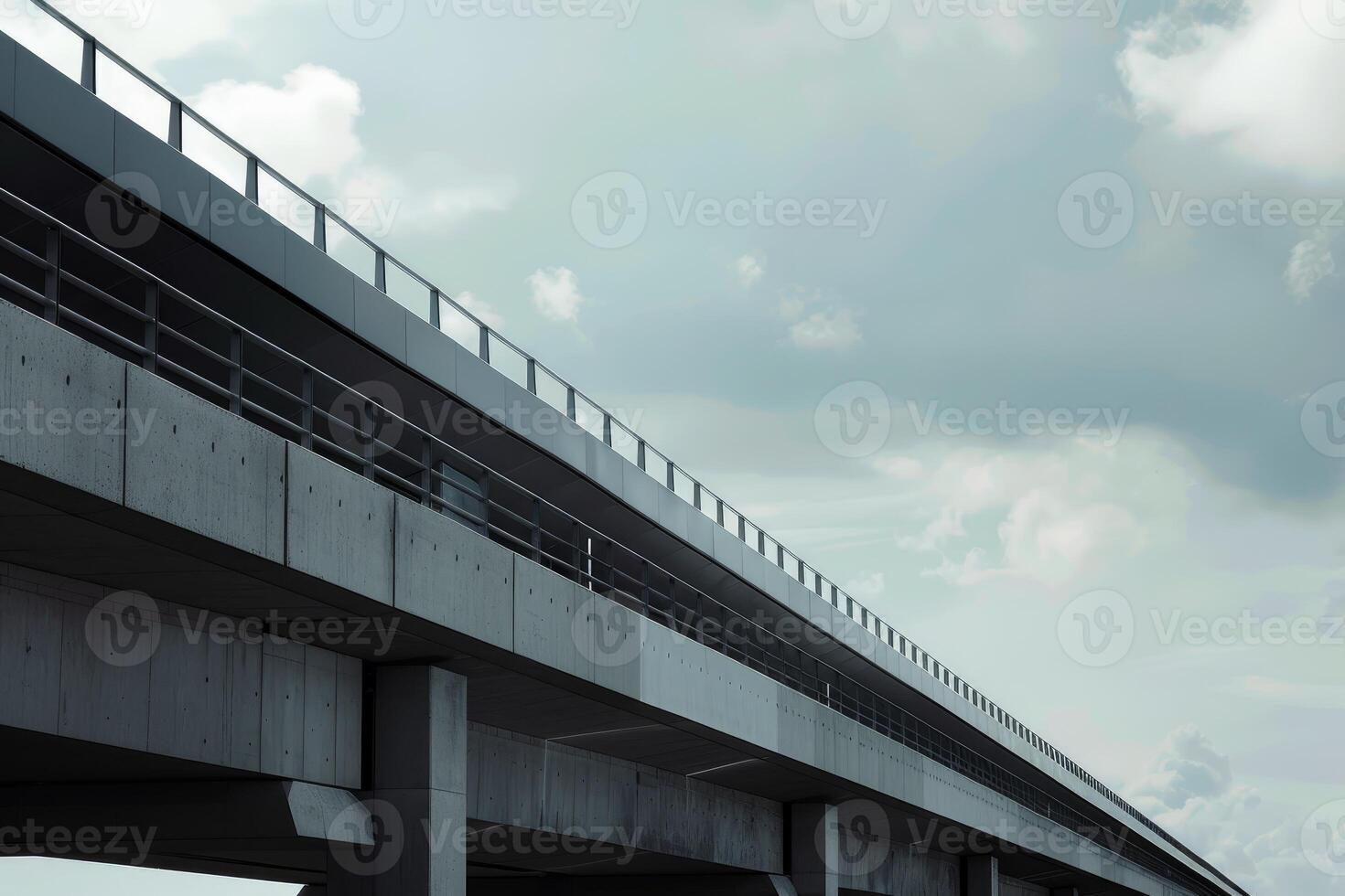 Concrete elevated highway is stretching into the distance under cloudy sky photo