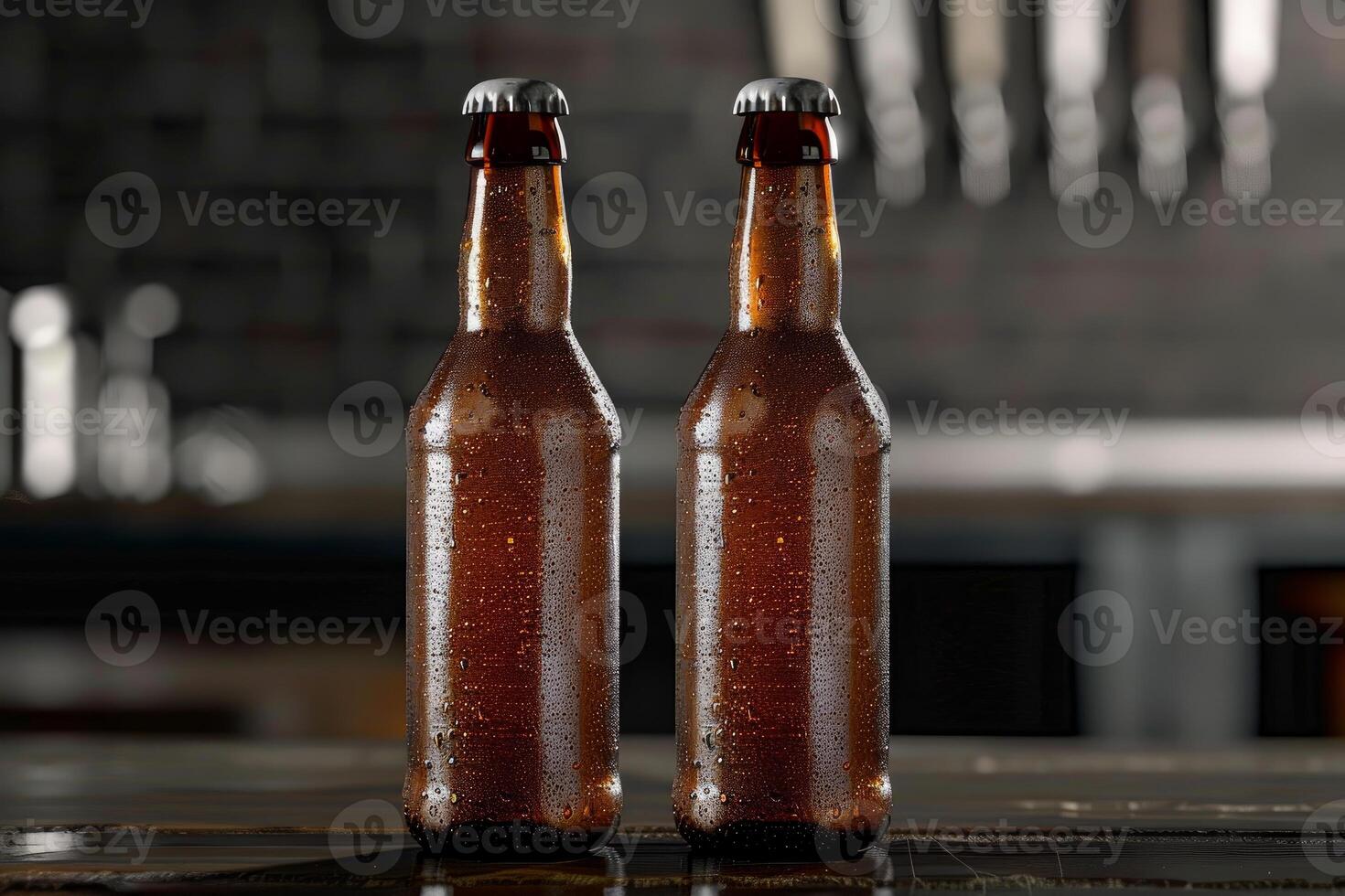 Two wet beer bottles standing on bar counter with blurred background photo