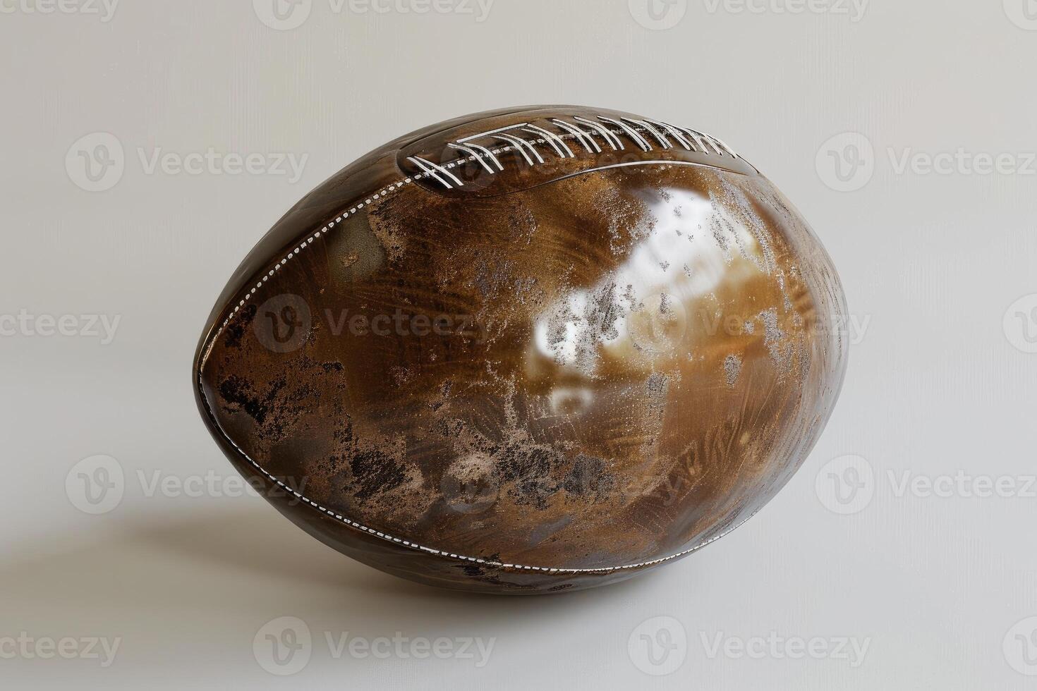 Old and worn leather rugby ball showing age and use photo