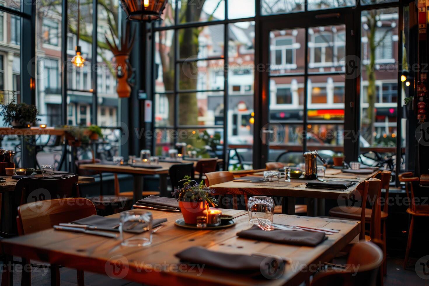 Modern restaurant interior design with wooden tables and big windows showing city street photo