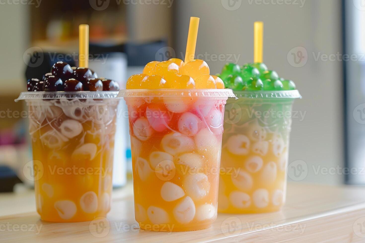 Three refreshing bubble tea drinks with boba and tapioca pearls photo