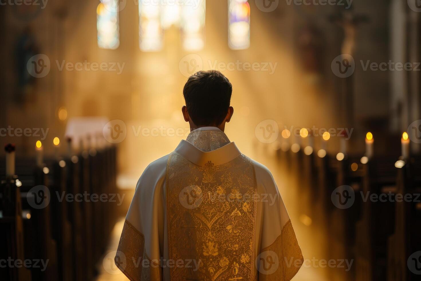 Priest at altar in sunlit church photo