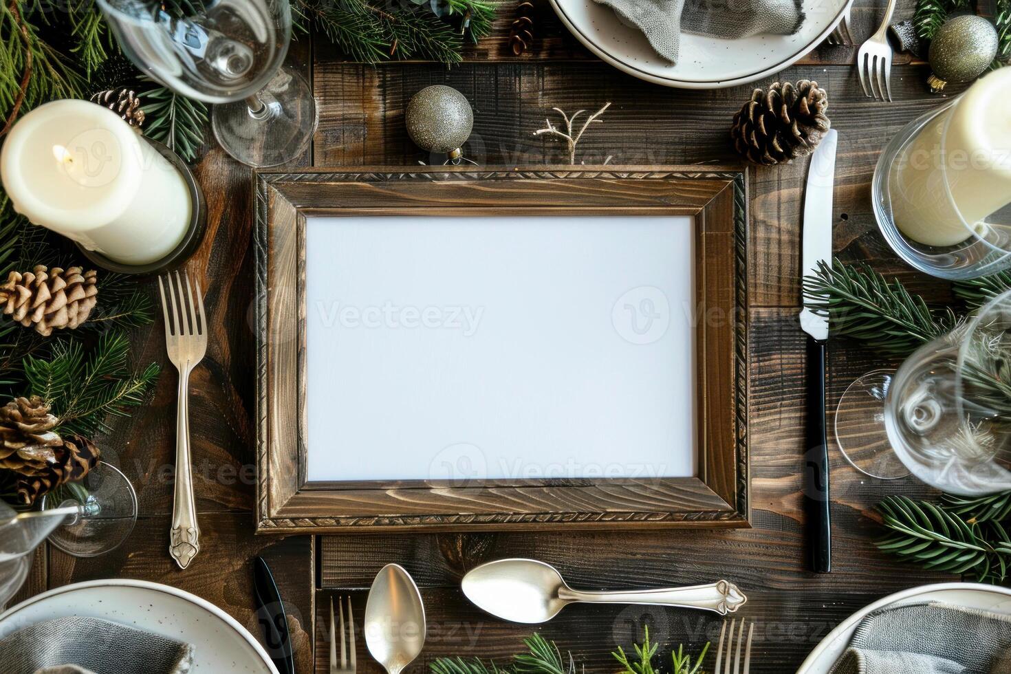 Empty picture frame lying on wooden table with christmas decoration photo