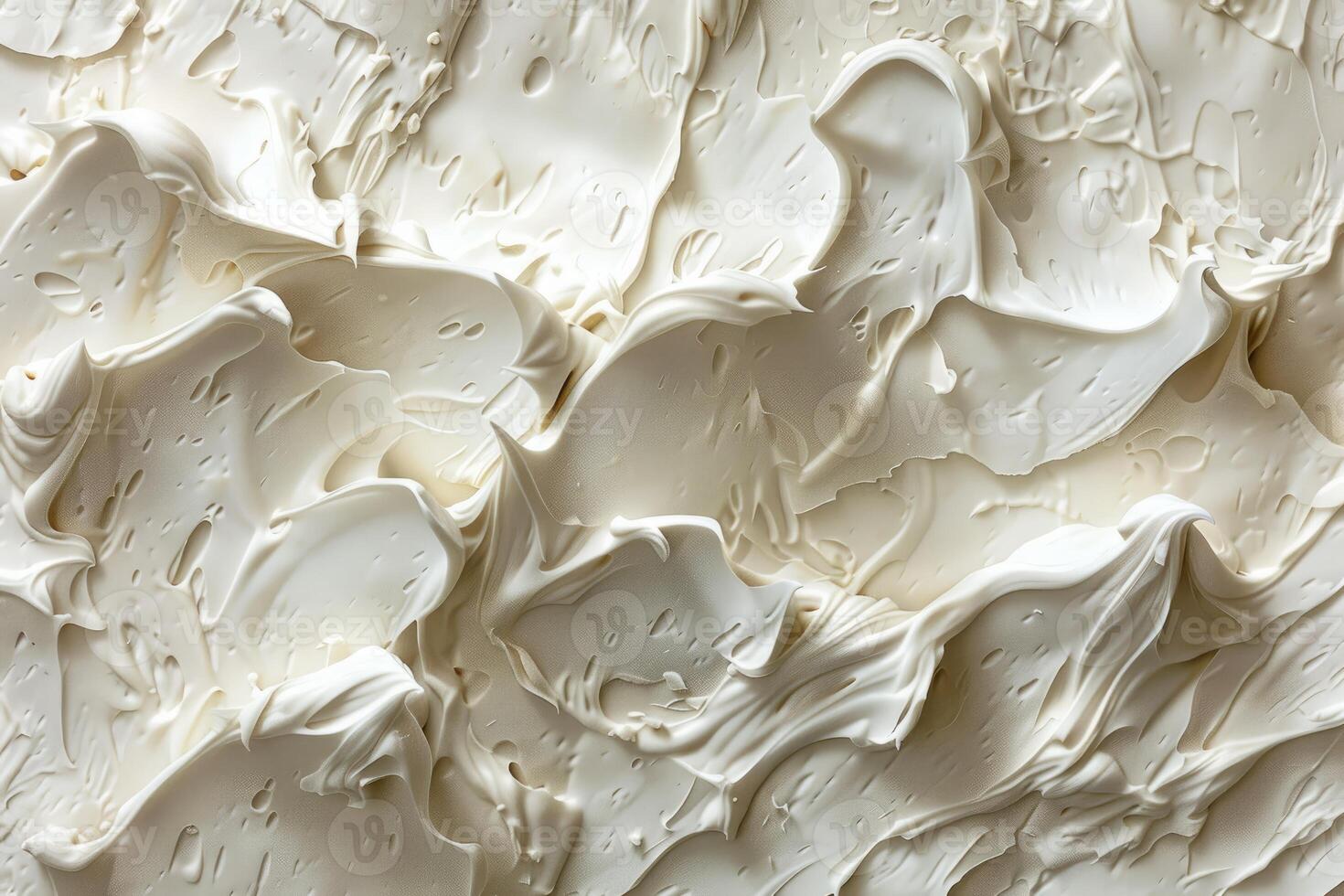 Closeup view of a smooth and undulating creamy texture with shadows photo