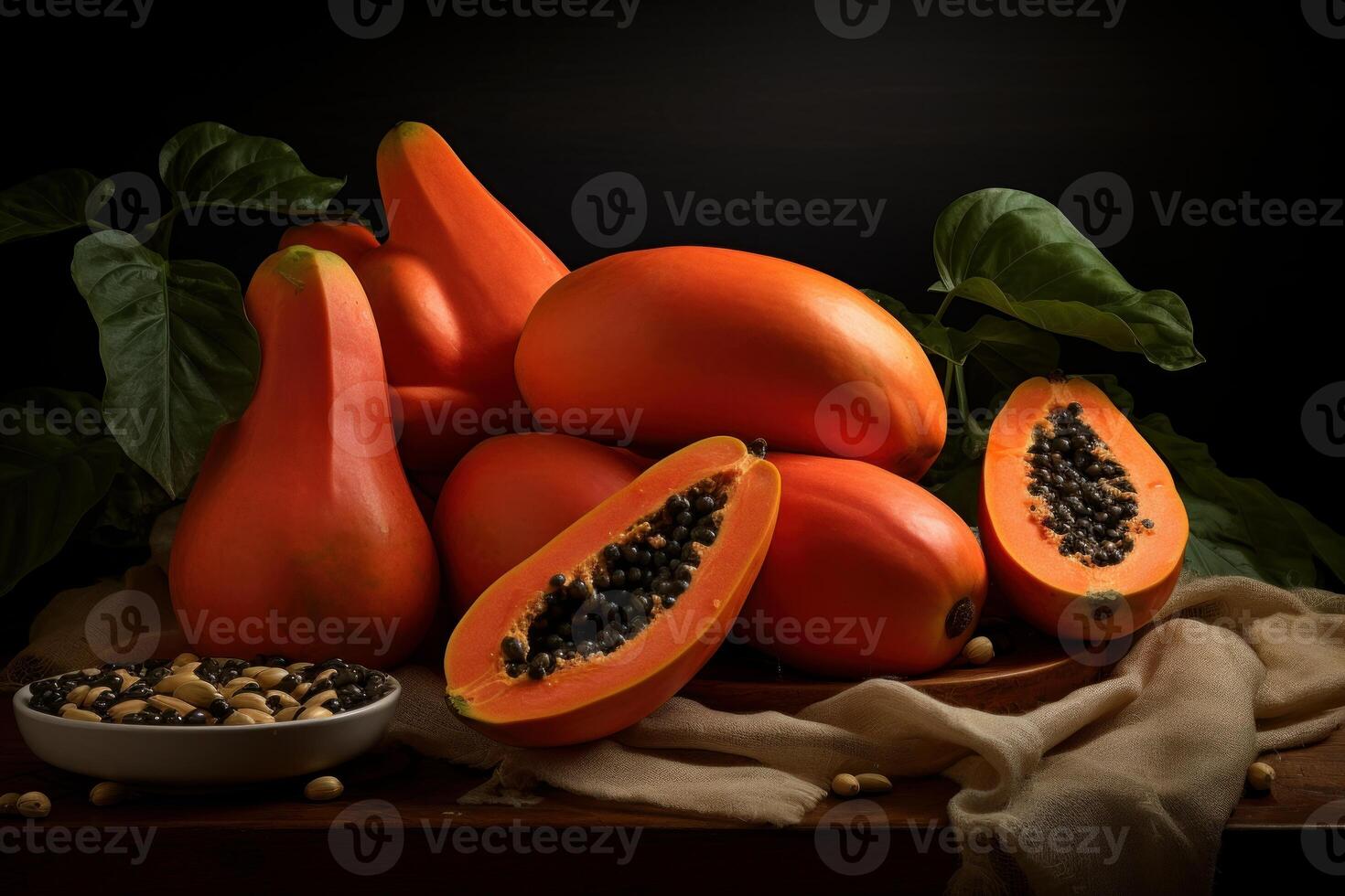 Ripe papaya assortment with seeds on dark background photo