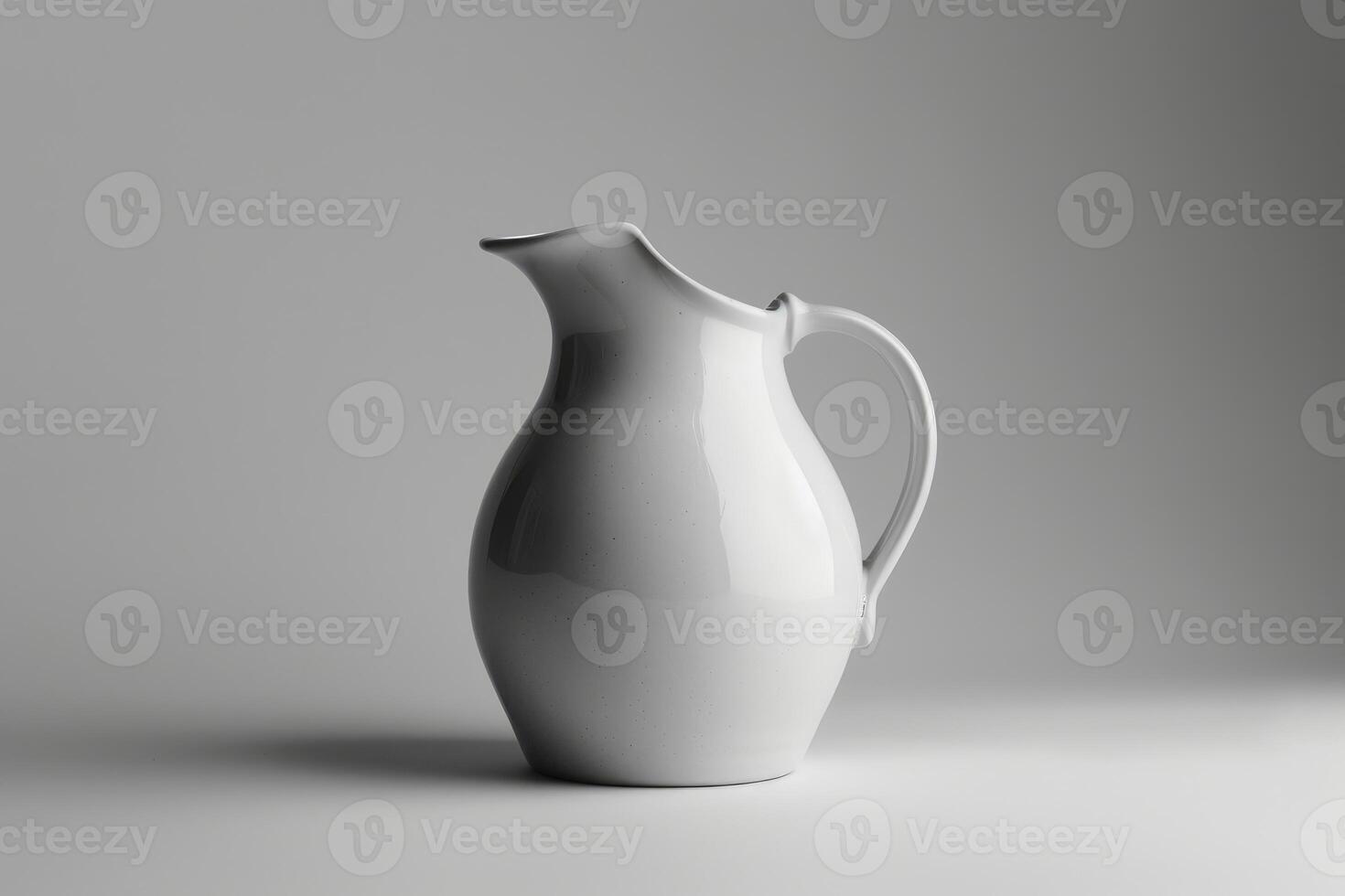 White ceramic pitcher standing on white surface with gray background photo