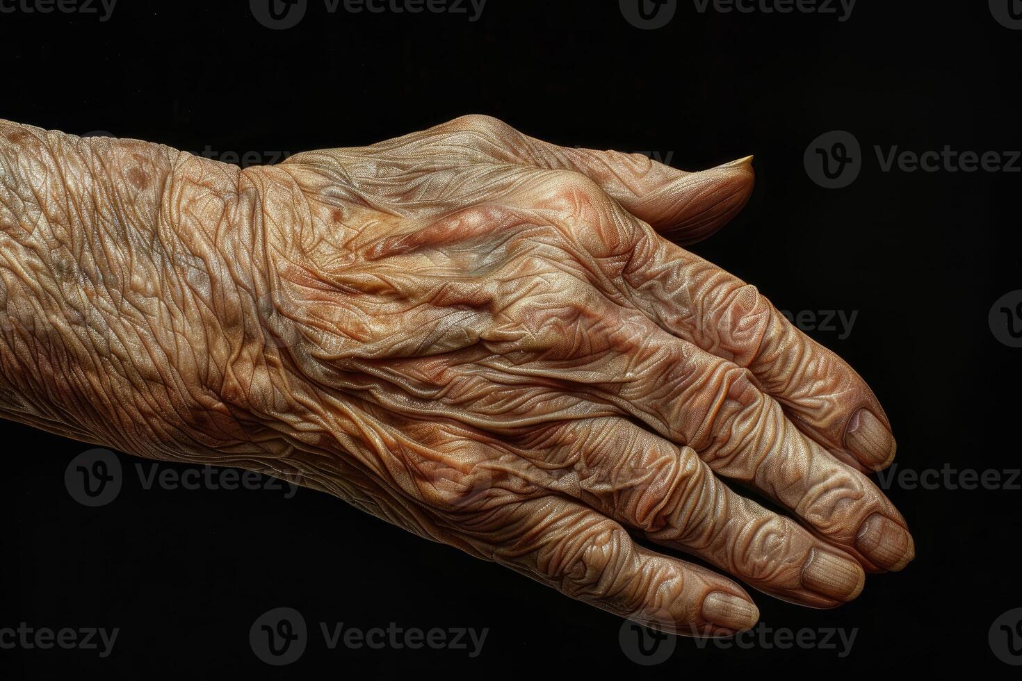 Old hand with deep wrinkles showing the effects of time and aging photo